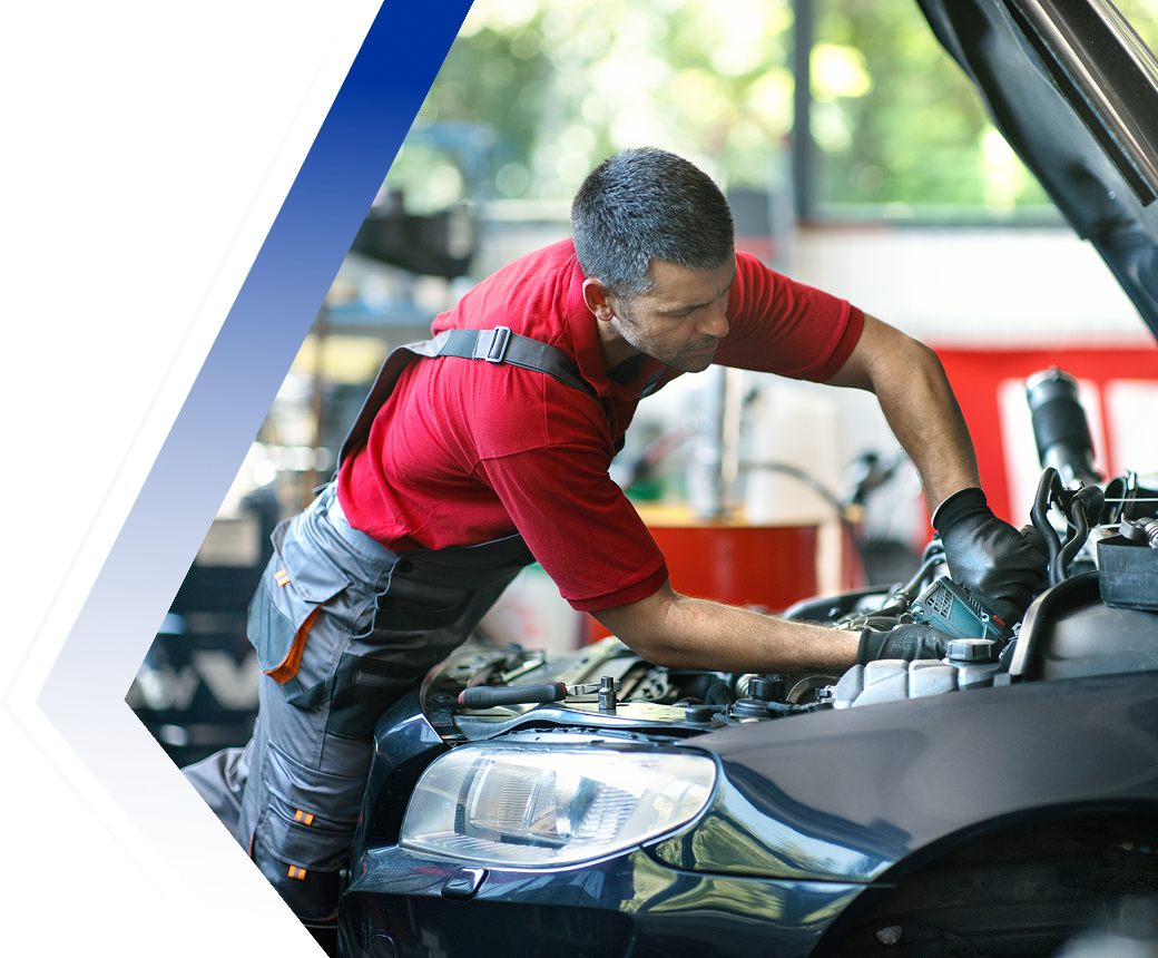 Mechanic working on a car engine.